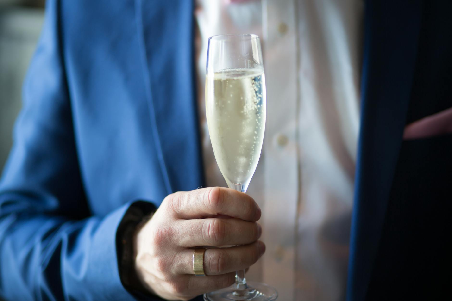 man holding filled champagne